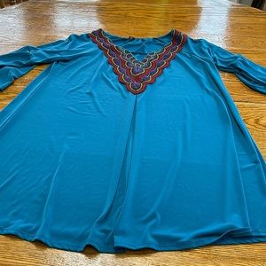 Vision blue polyester v-neck top, bell sleeves, embroidered. Size Large